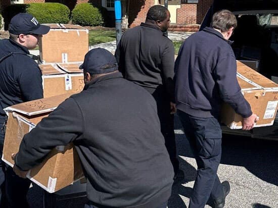 Deputies Carrying Boxes of Vests