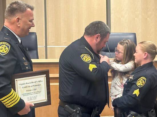 Sgt Eller Being Pinned by his Daughter