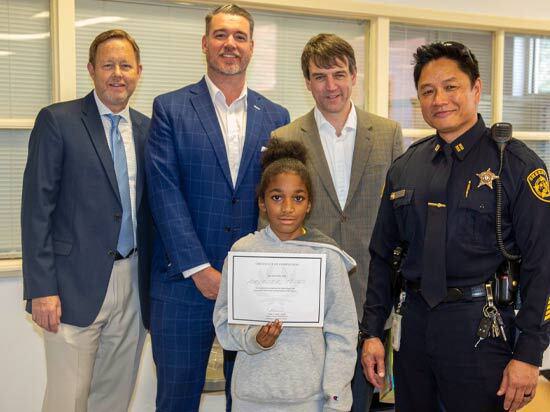 Child Receiving Certificate from Mentor Program